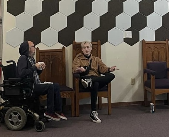 Aidan Keeble, PSC student, talks with Adam Scartozzi at Joy Bomb